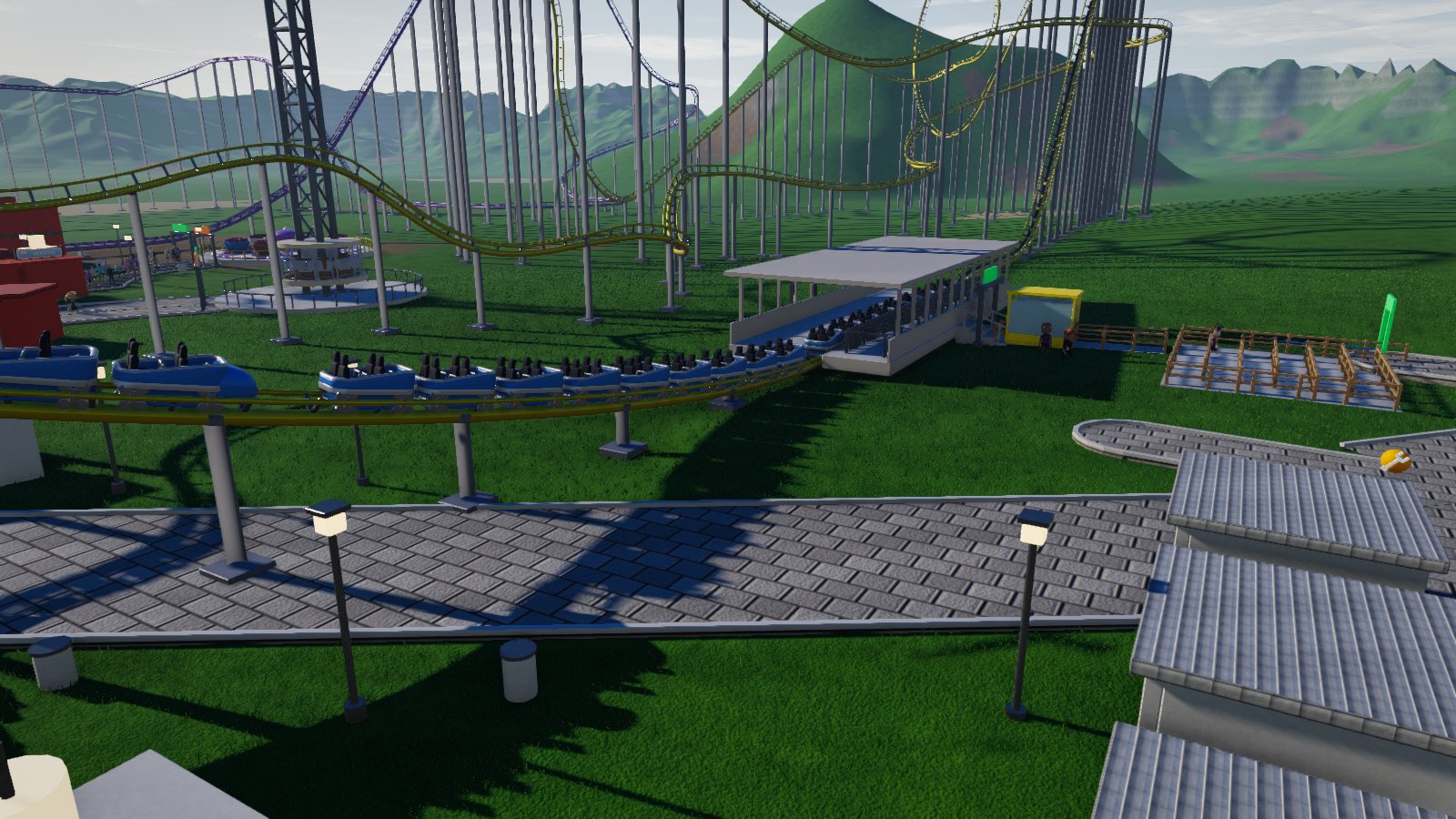 Estación de una montaña rusa con el tren entrando
